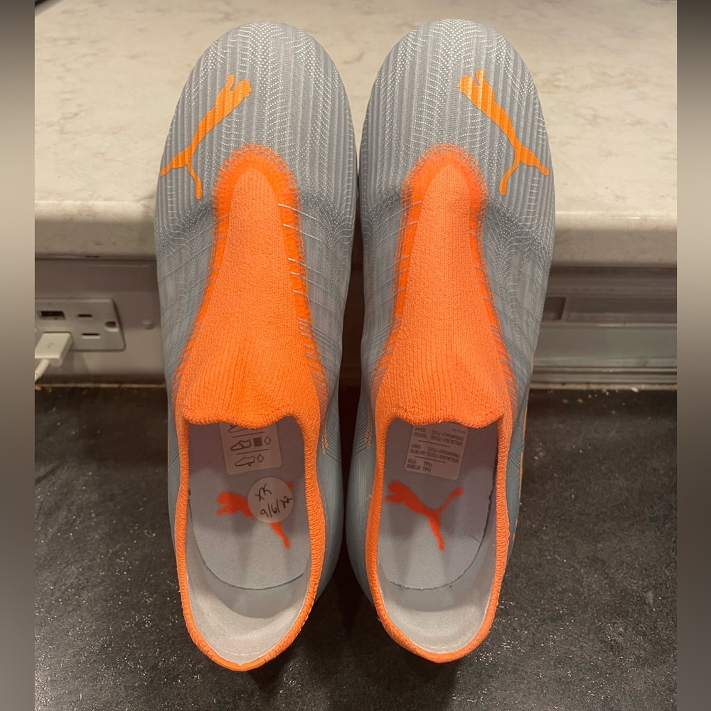 Puma Kids Ultra Orange Soccer Cleats, size 3.5.
